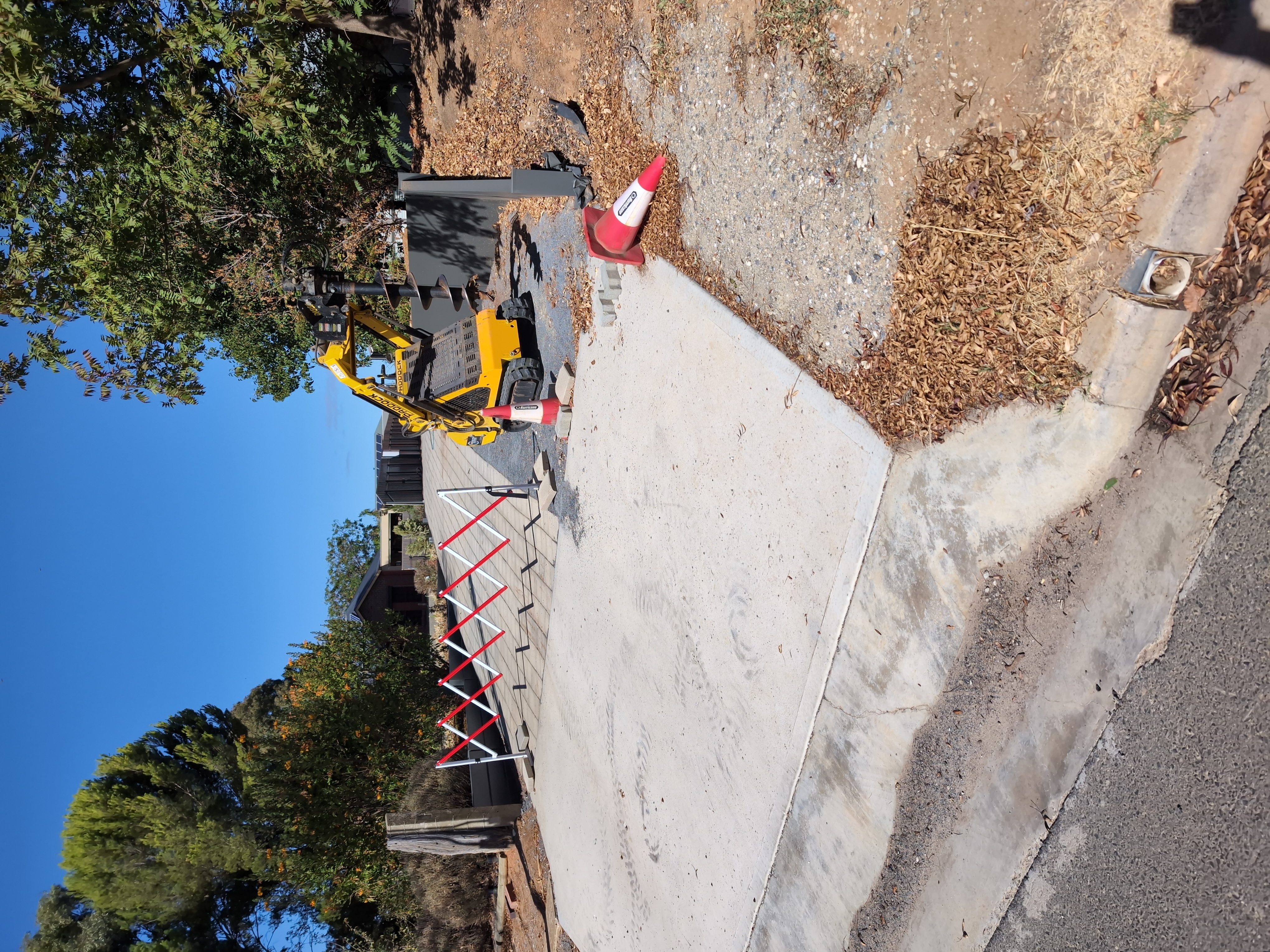 Expandable safety barrier used to protect telecommunications or infrastructure access point